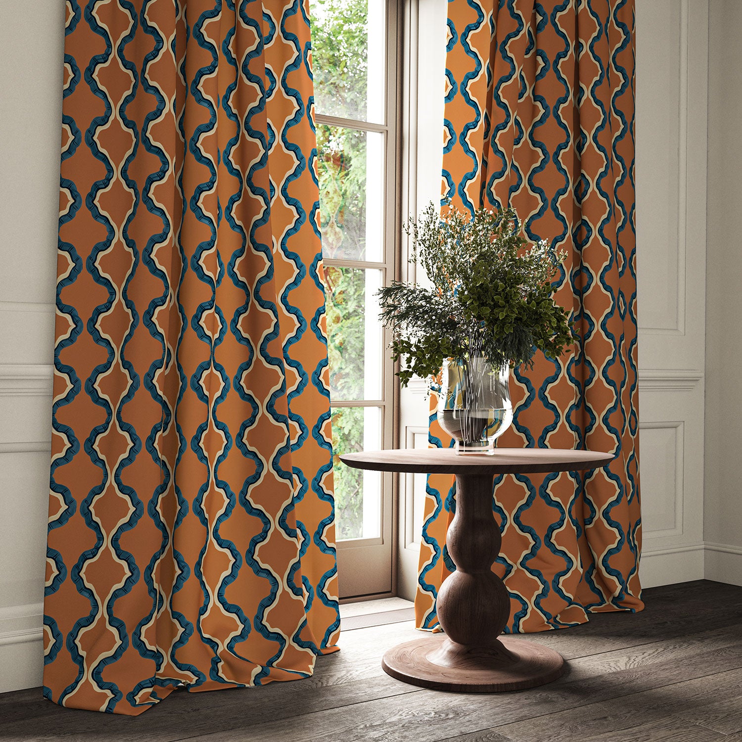 Curtains made from a printed linen fabric in blue, orange, black and off white featuring a mirrored ribbon pattern.