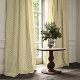 Curtains made from a printed linen fabric in yellow, blue and off white featuring a Japanese print.