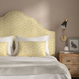 Headboard upholstered in a printed linen fabric in yellow, blue and off white featuring a Japanese print.