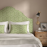 Headboard upholstered in a printed linen fabric in green and off white featuring a Japanese print.