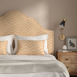 Headboard upholstered in a printed linen fabric in orange and off white featuring a Japanese print.