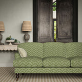 Sofa upholstered in a printed linen fabric in green and off white featuring a Japanese print.