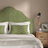 Headboard upholstered in a printed linen fabric in green and off white featuring a Japanese print.