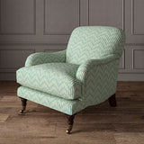 Armchair upholstered in a printed linen fabric in blue and off white featuring a Japanese print.