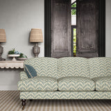 Sofa upholstered in a printed linen fabric in blue, orange, and off white featuring a Japanese print.