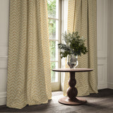 Curtains made from a printed linen fabric in orange and off white featuring a Japanese print.