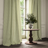 Curtains made from a printed linen fabric in green and off white featuring a Japanese print.