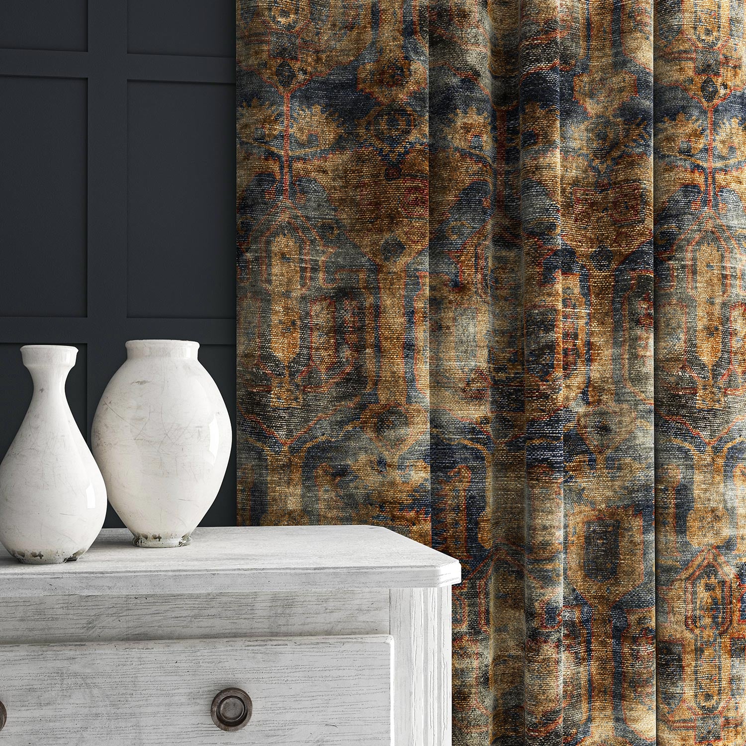 A curtain made from a printed velvet fabric in blue, brown and black featuring an opulent pattern.