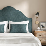 Headboard upholstered in a plain luxurious woven fabric in blue.