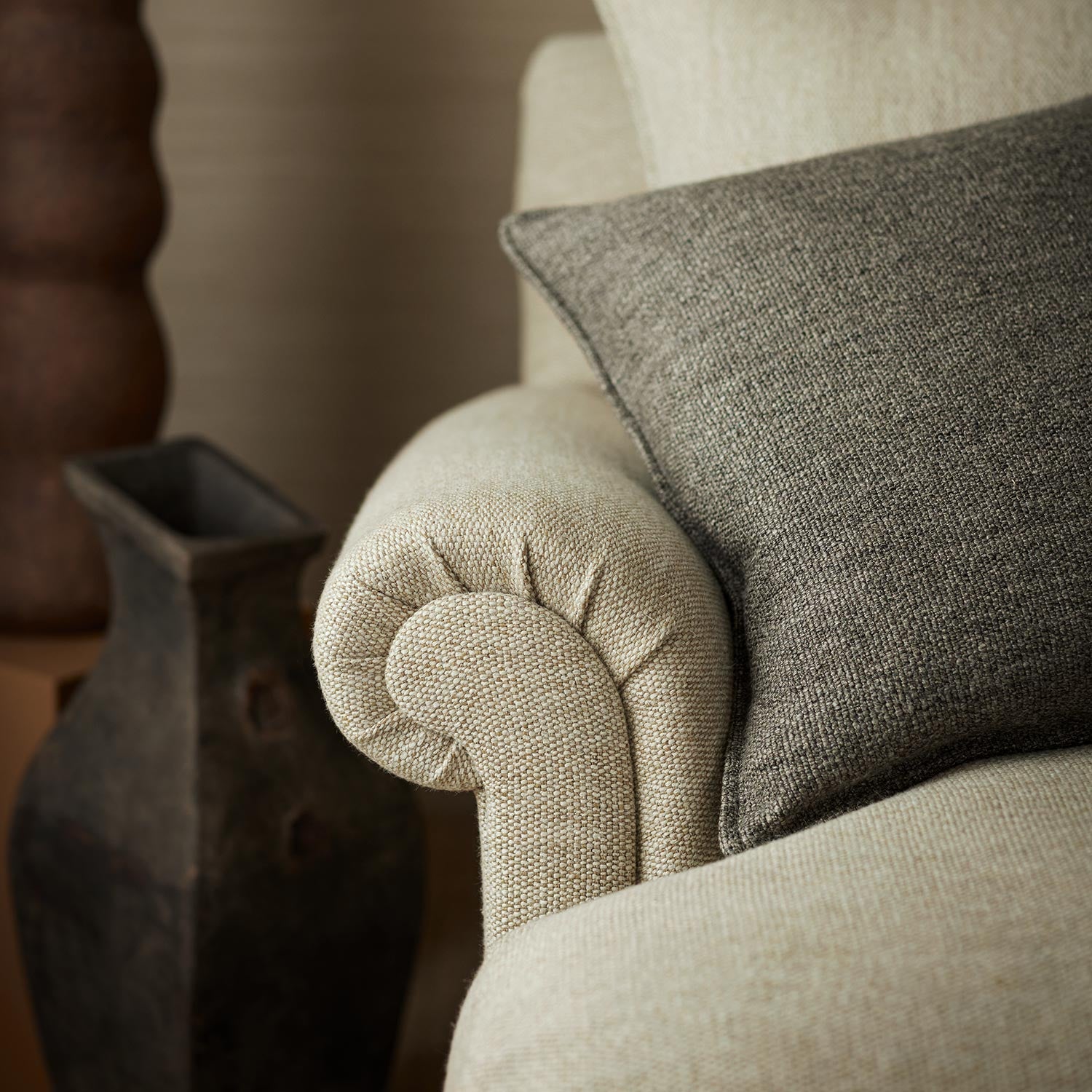 Chair upholstered in a plain luxurious woven fabric in cream.