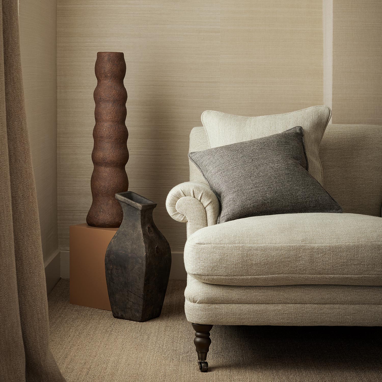 Chair upholstered in a plain luxurious woven fabric in cream.
