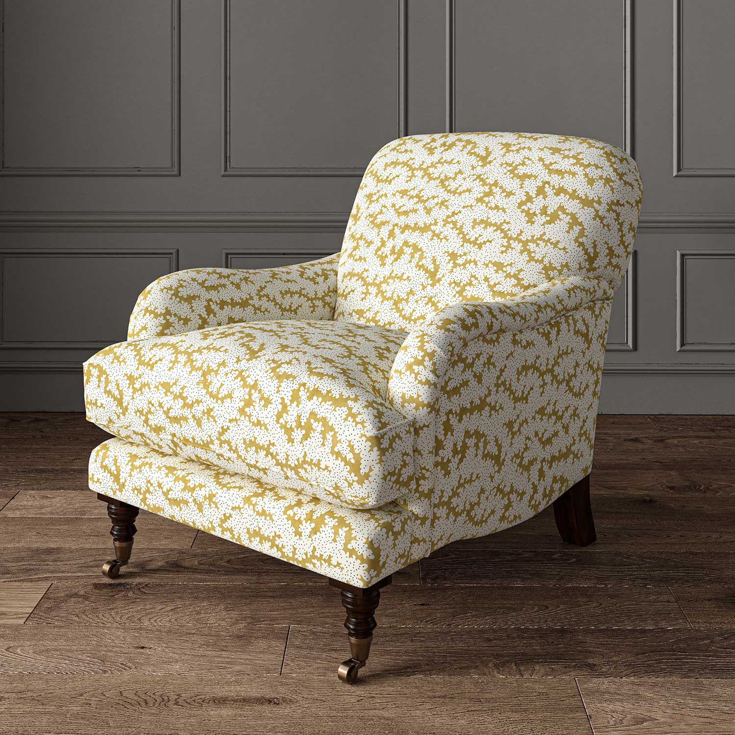 Chair upholstered in a printed linen fabric sample in yellow, blue and off white featuring a stylized coral pattern.