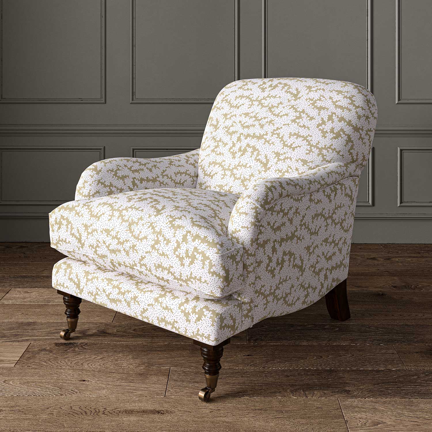 Chair upholstered in a printed linen fabric sample in brown, blue and off white featuring a stylized coral pattern.