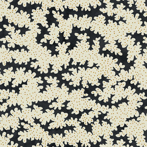 A printed linen fabric sample in black, brown and off white featuring a stylized coral pattern.