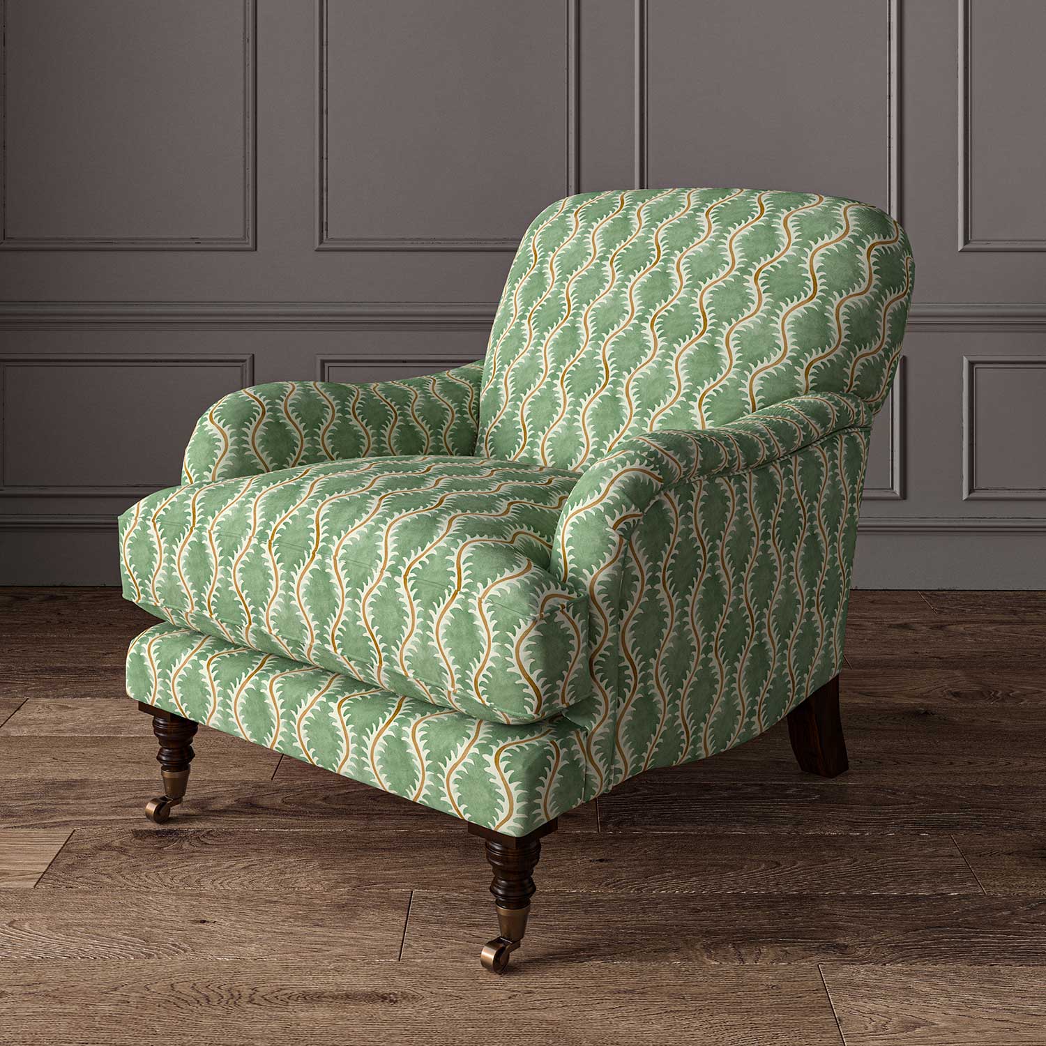 Chair upholstered in a printed linen fabric sample in green, brown and off white featuring a stylized fern pattern.
