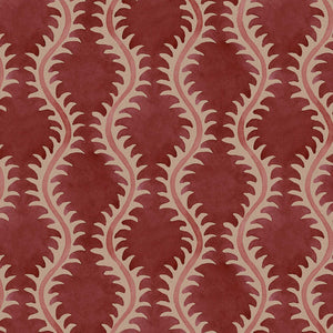 A printed linen fabric sample in red and pink featuring a stylized fern pattern.