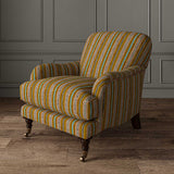 Armchair in a multicoloured printed linen fabric featuring stripes, wavy edges and zigzags.