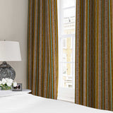Curtains in a multicoloured printed linen fabric featuring stripes, wavy edges and zigzags.