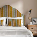 Headboard in a multicoloured printed linen fabric featuring stripes, wavy edges and zigzags.