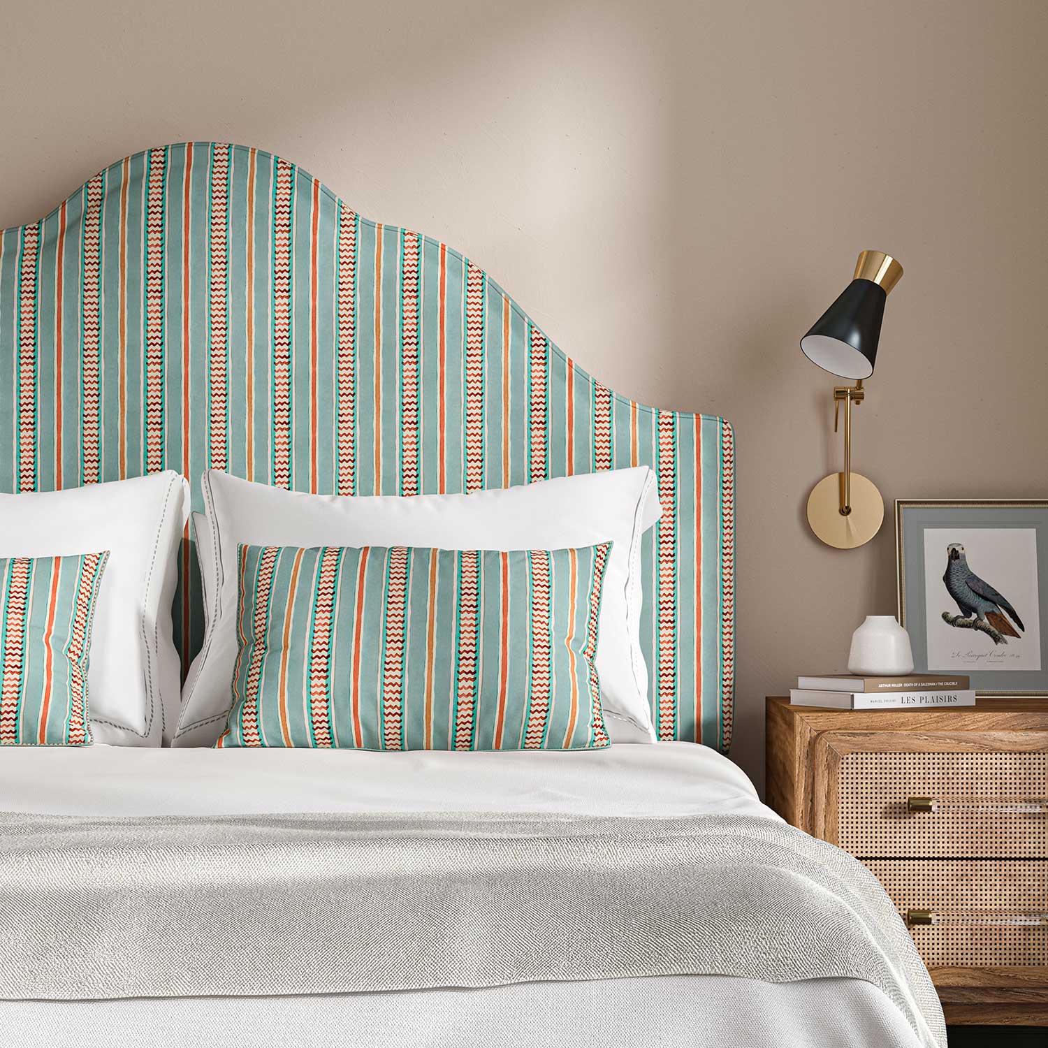 Headboard in a multicoloured – blue, red and pink – printed linen fabric featuring stripes, wavy edges and zigzags.