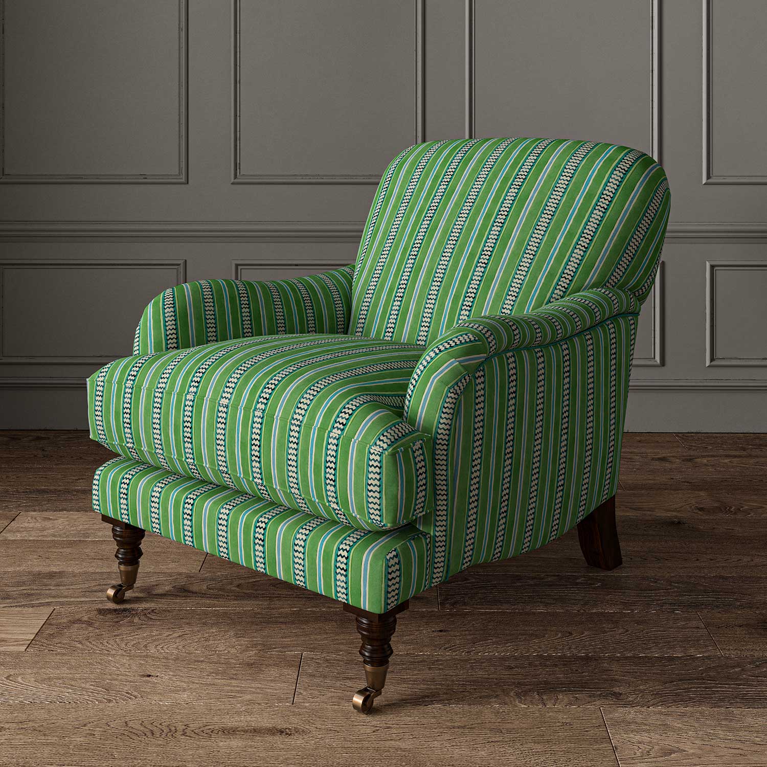 Armchair in a multicoloured – green and blue – printed linen fabric featuring stripes, wavy edges and zigzags.
