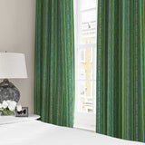 Curtains in a multicoloured – green and blue – printed linen fabric featuring stripes, wavy edges and zigzags.
