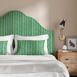 Headboard in a multicoloured – green and blue – printed linen fabric featuring stripes, wavy edges and zigzags.