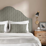 Headboard upholstered in a printed linen fabric in black, brown and off white featuring a sound wave pattern