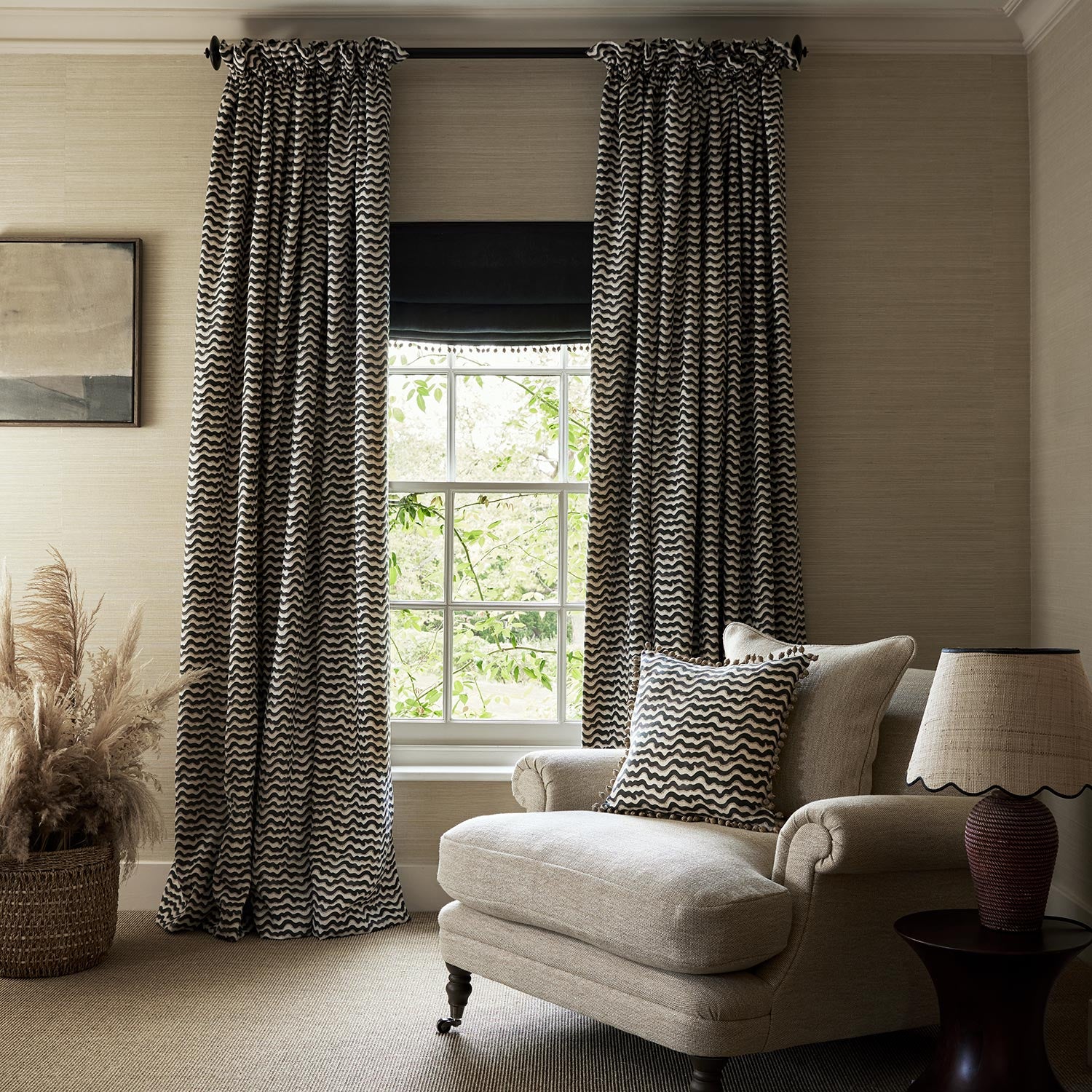 Curtains and cushions made from a printed linen fabric in black, brown and off white featuring a sound wave pattern