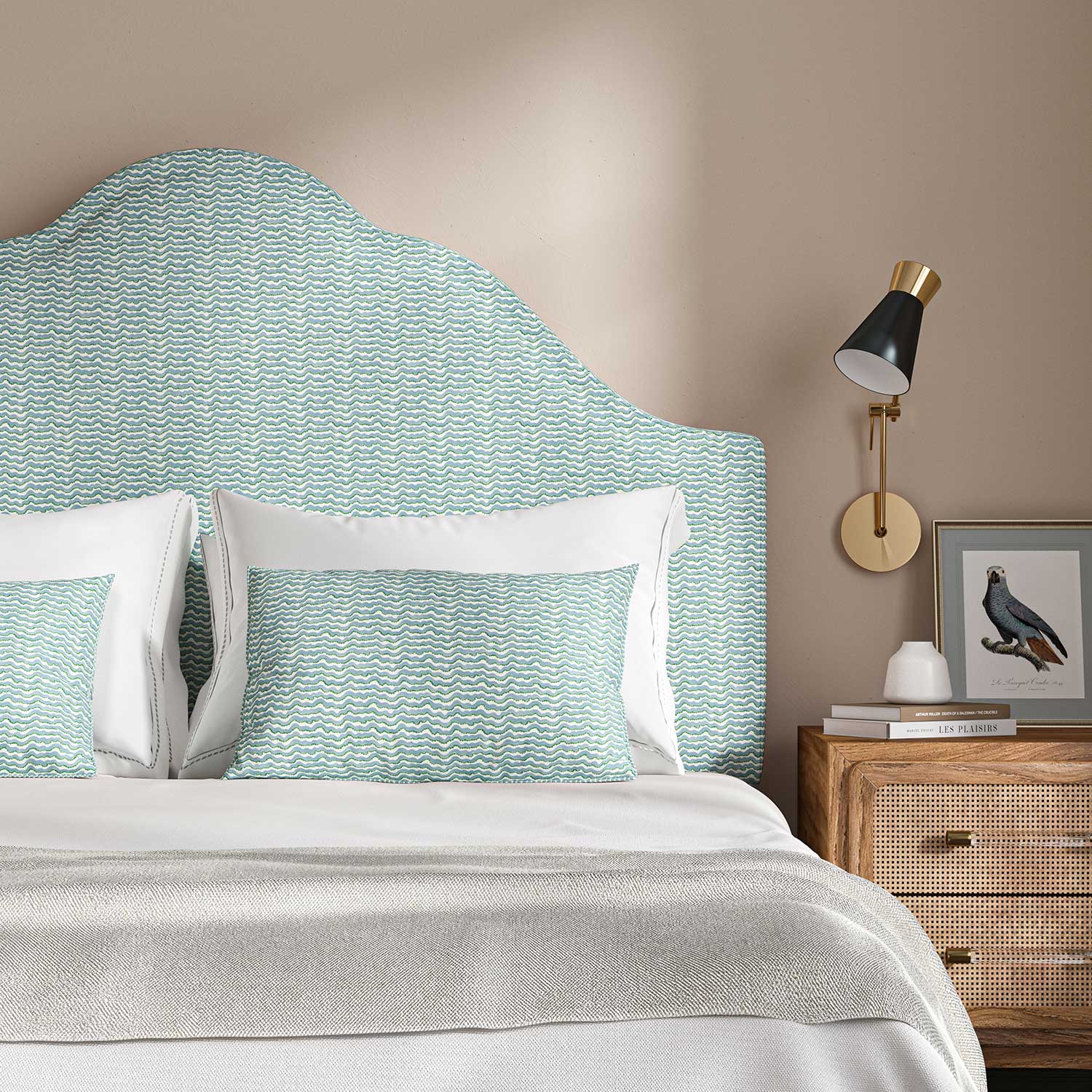 Headboard upholstered in a printed linen fabric in blue, green and off white featuring a sound wave pattern