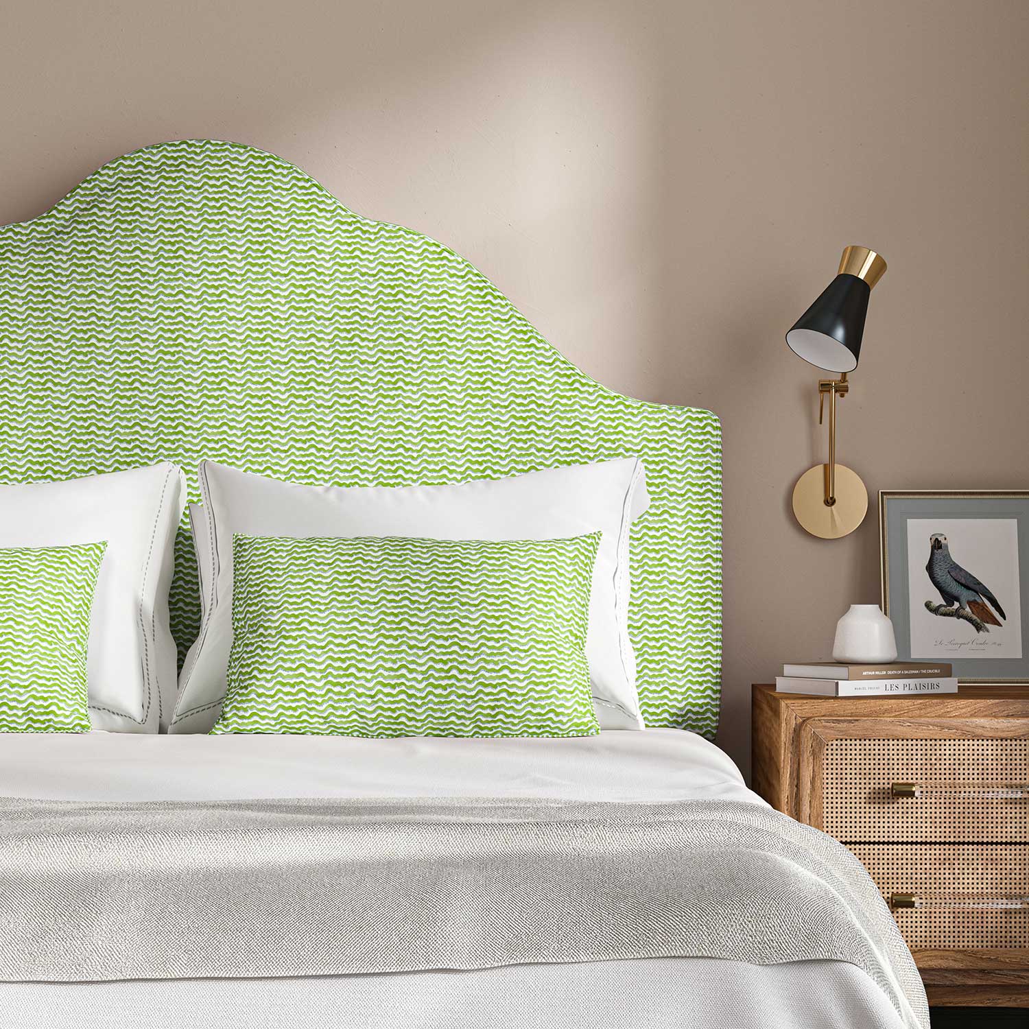Headboard upholstered in a printed linen fabric in blue, green and off white featuring a sound wave pattern