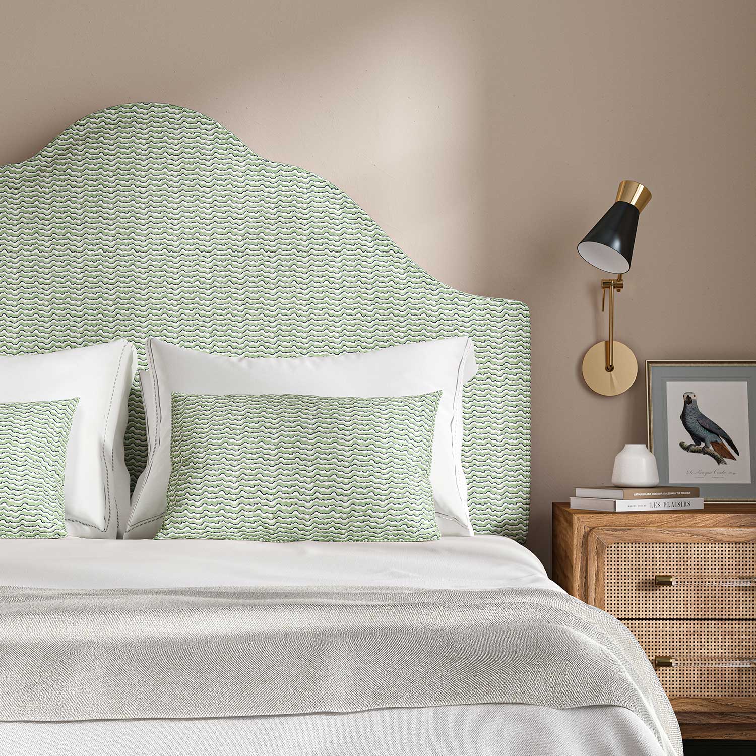 Headboard upholstered in a printed linen fabric in green, black and off white featuring a sound wave pattern