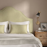 Woven cream coloured fabric on a headboard