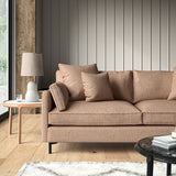 Woven Salmon coloured fabric on a sofa