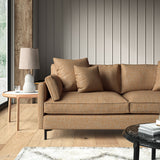 Woven orange coloured fabric on a sofa