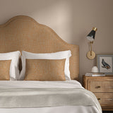 Woven orange coloured fabric on a headboard