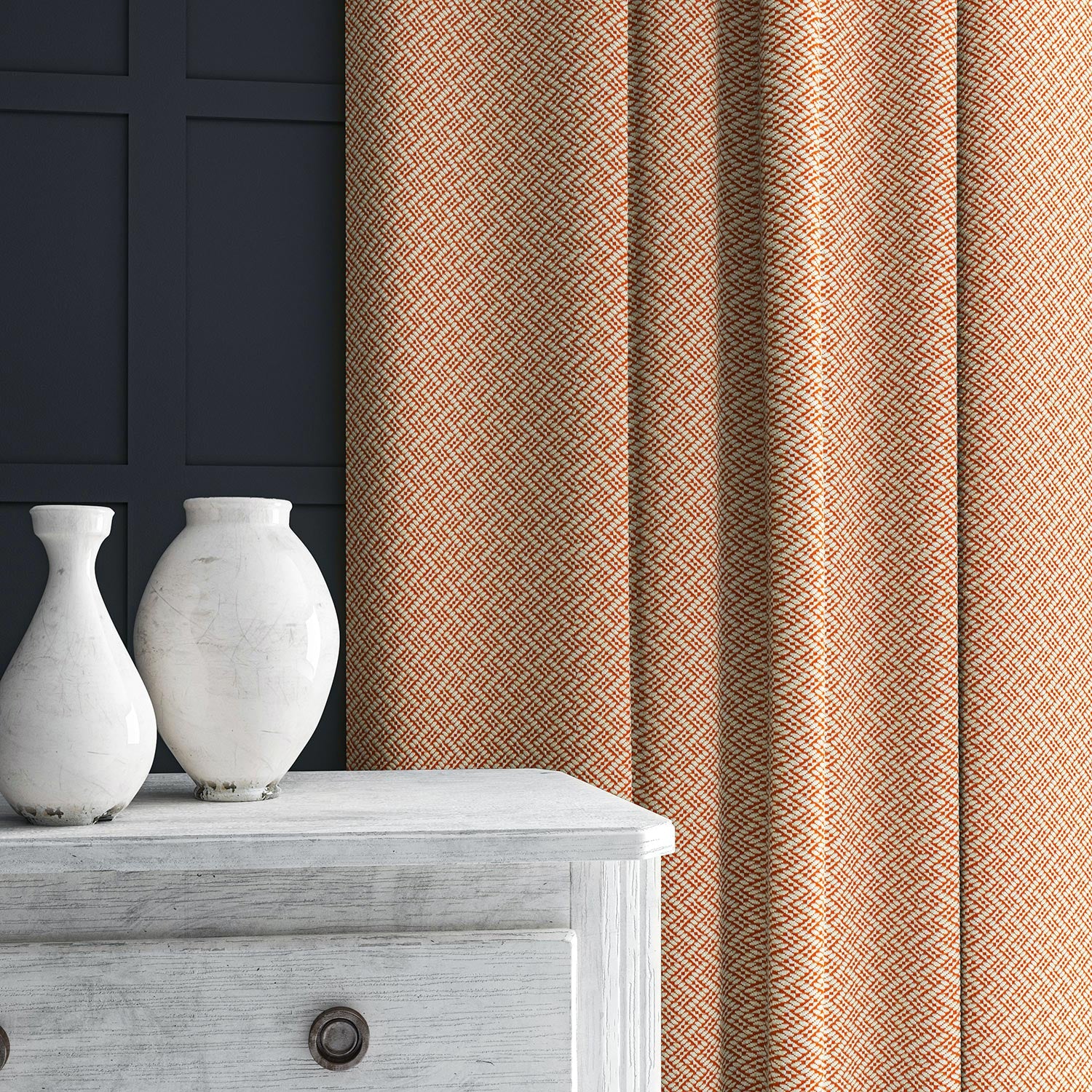Curtain in orange and off-white woven fabric featuring a trellis pattern.
