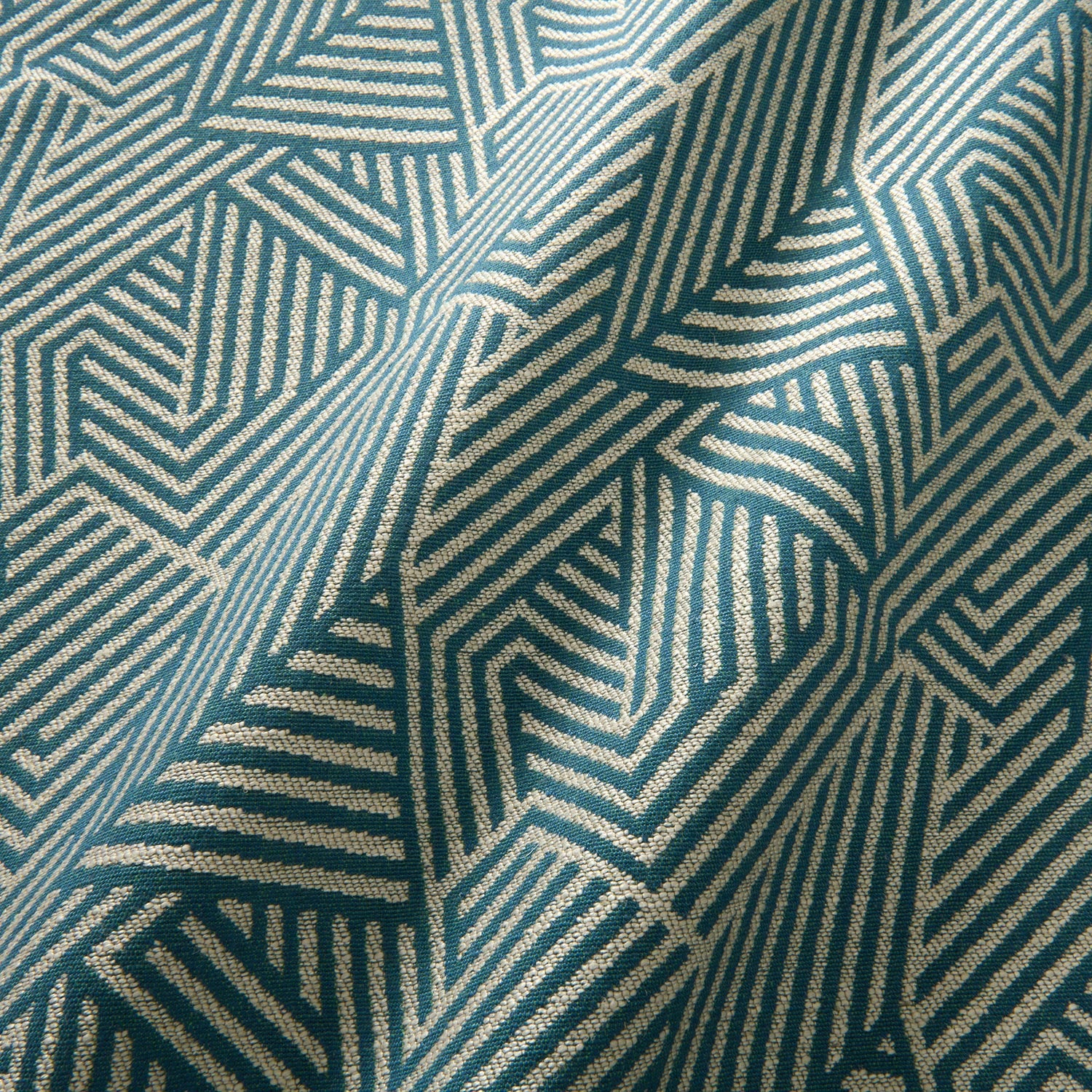 A woven fabric sample in blue and off-white featuring a geometric pattern.