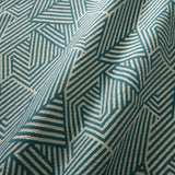 A woven fabric sample in blue and off-white featuring a geometric pattern.