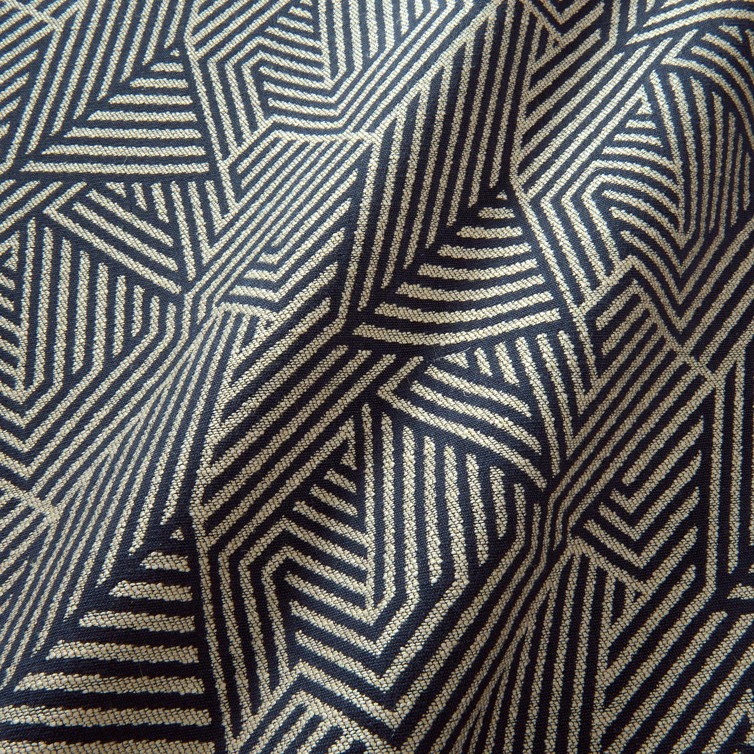 A woven fabric sample in blue and off-white featuring a geometric pattern.
