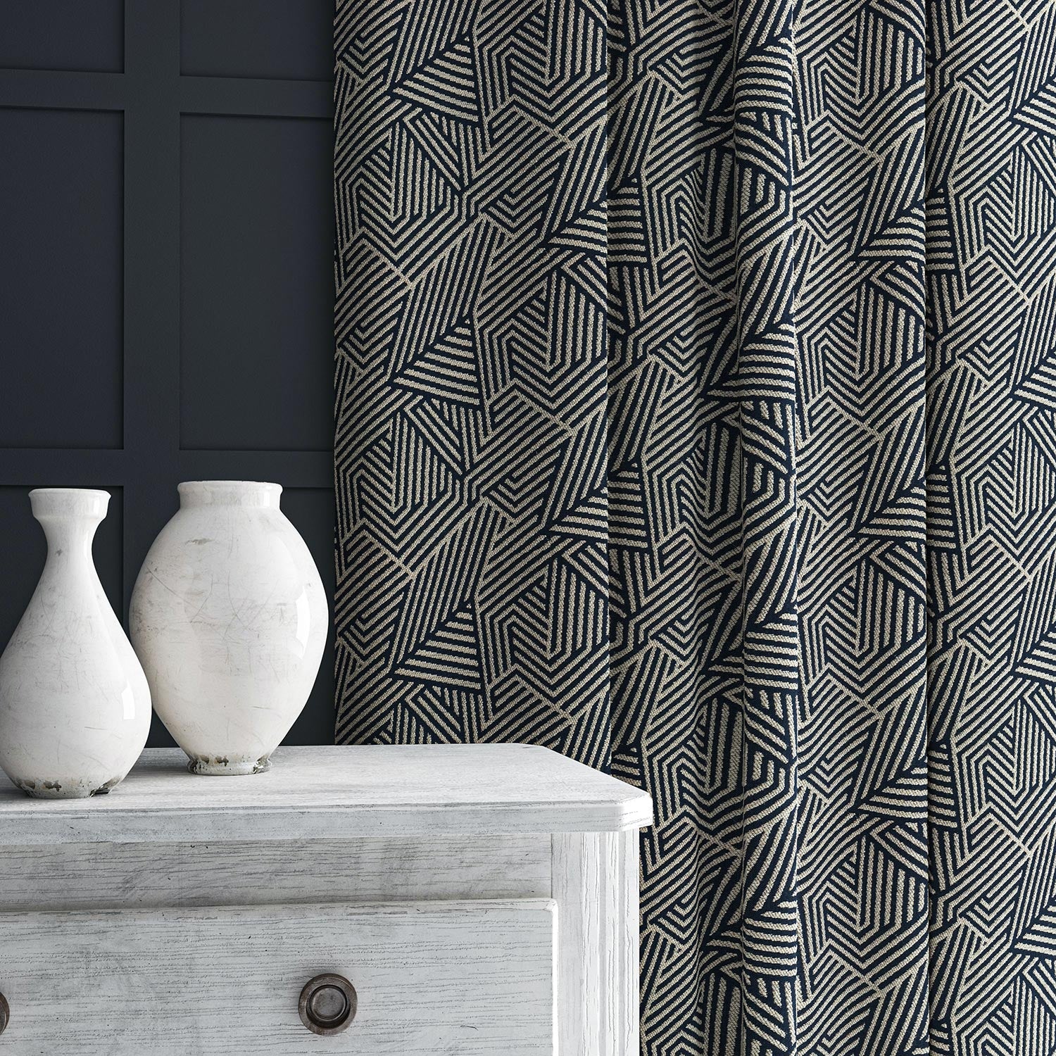 Curtain in blue and off-white woven fabric featuring a geometric pattern.