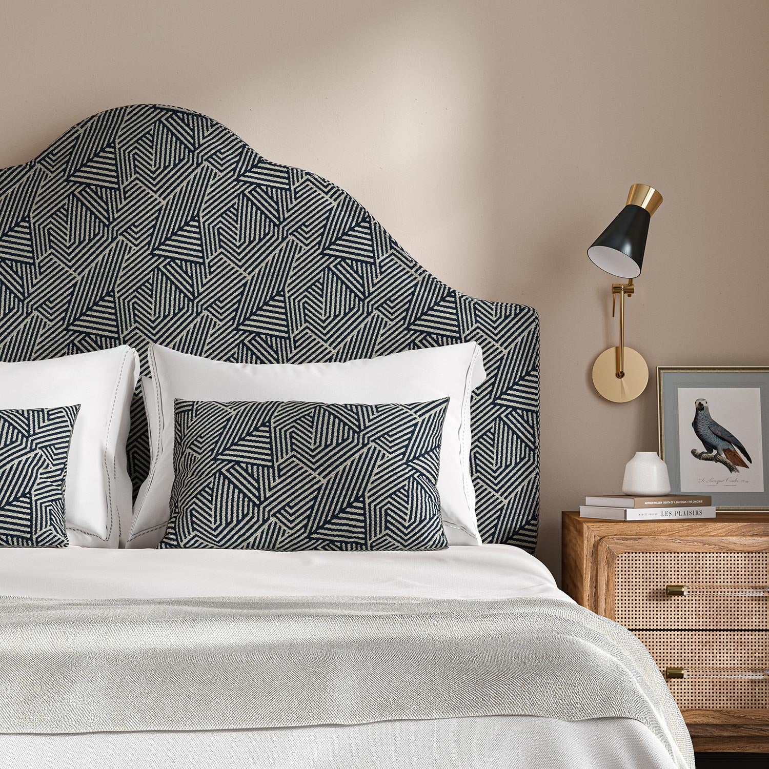 Headboard upholstered in a blue and off-white woven fabric featuring a geometric pattern.