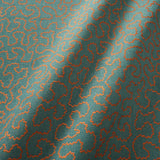 A woven fabric sample in blue and orange featuring a coral wavy pattern.