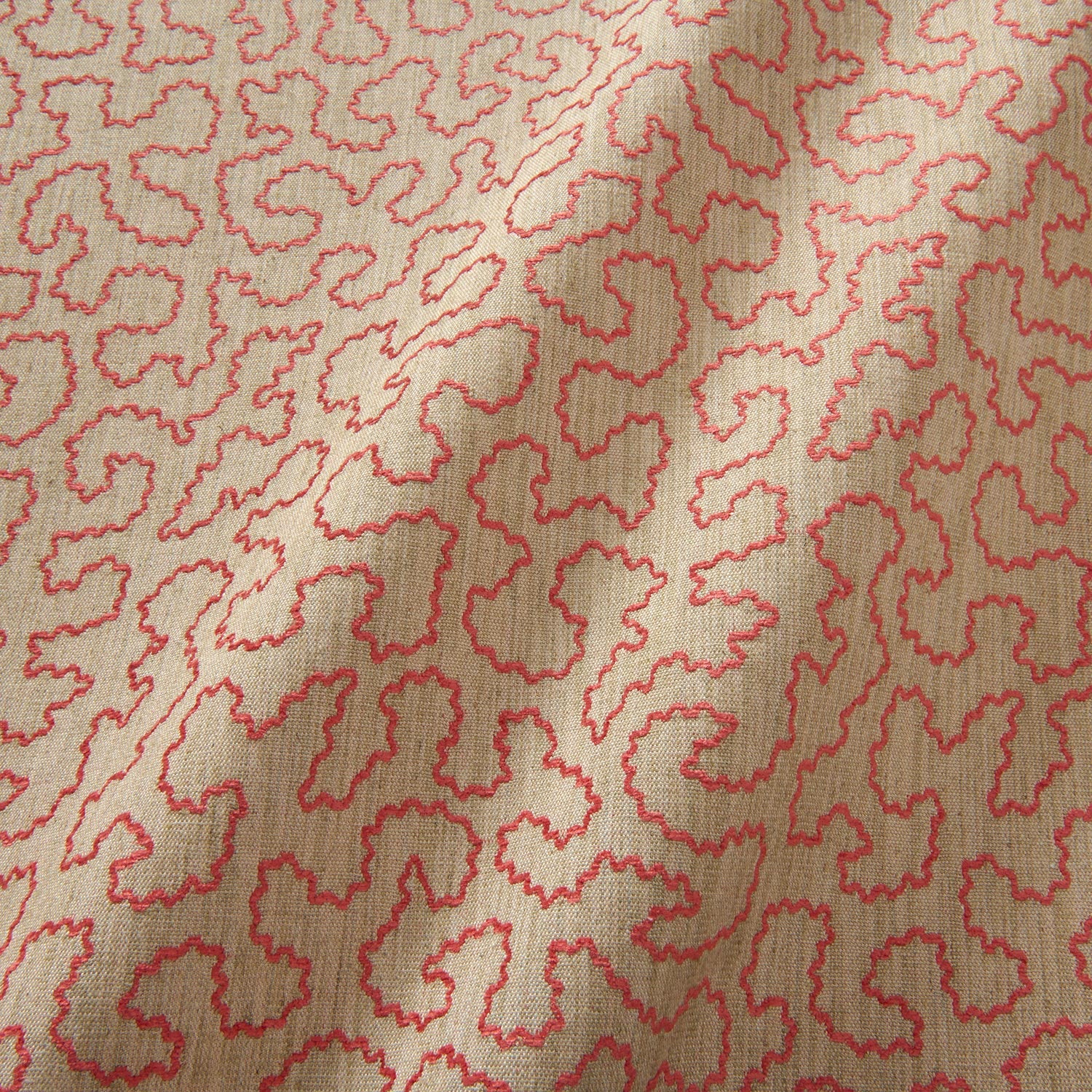 A woven fabric sample in pink and off-white featuring a wavy pattern.