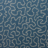 A woven fabric sample in blue and off-white featuring a wavy pattern.