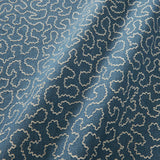 A woven fabric sample in blue and off-white featuring a wavy pattern.