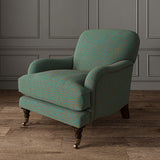 Chair upholstered in a blue and orange woven fabric featuring a wavy pattern.