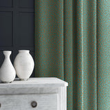 Curtain in blue and orange woven fabric featuring a wavy pattern.