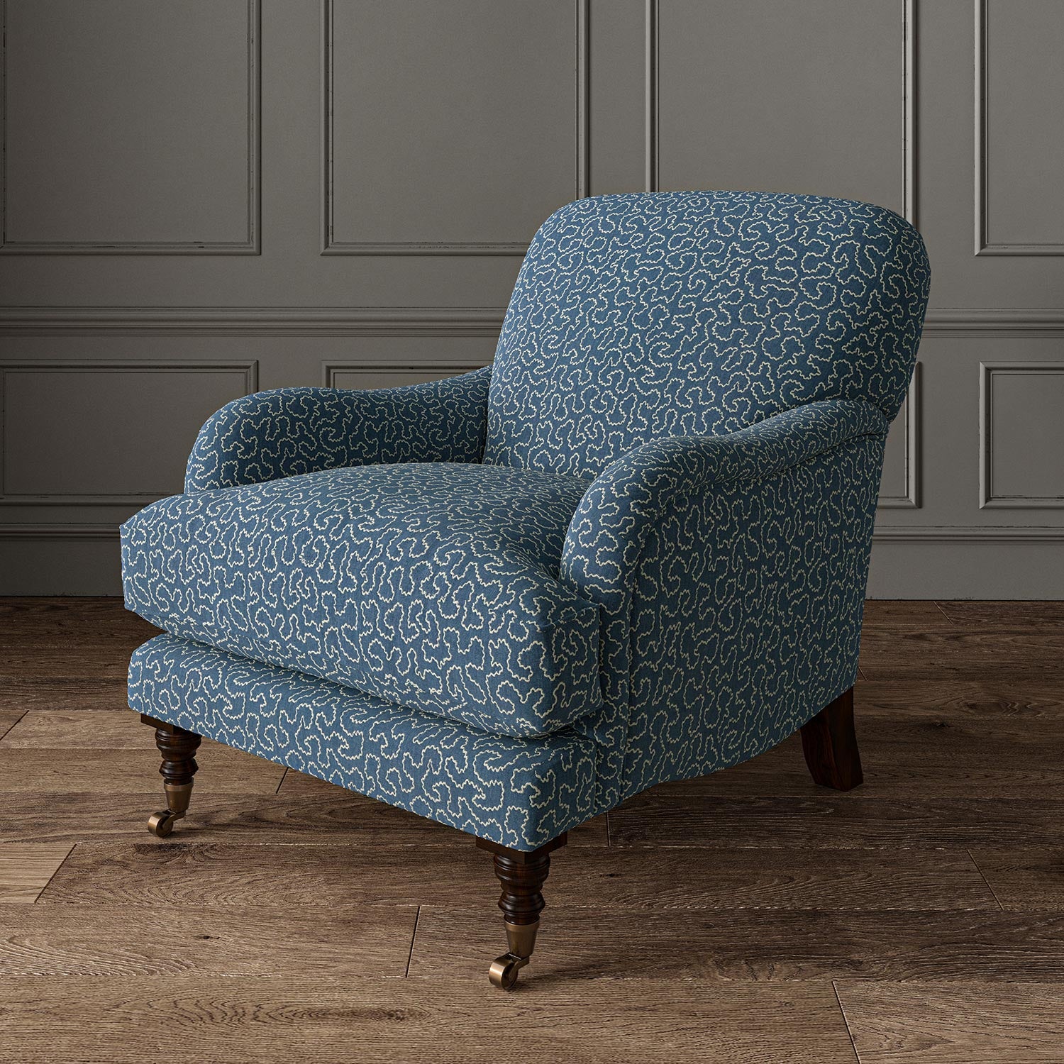 Chair upholstered in a blue and off-white woven fabric featuring a wavy pattern.