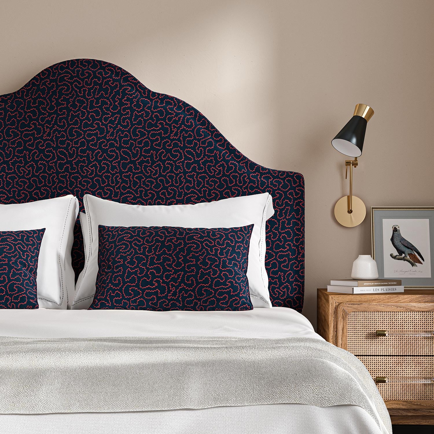 Headboard upholstered in a blue and red woven fabric featuring a wavy pattern.